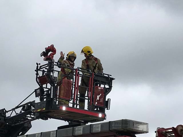 Thompsons' solicitors on a fireman's ladder.